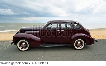 Felixstowe, Suffolk, England - May 05, 2019: Classic Dark Red Studebaker  Motor Car Parked  On Seafr