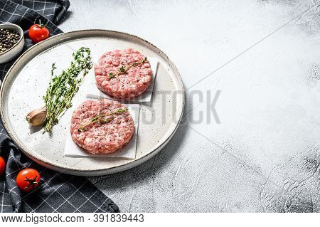 Raw Chicken Cutlets, Ground Meat Patty. Organic Mince. White Background. Top View. Copy Space