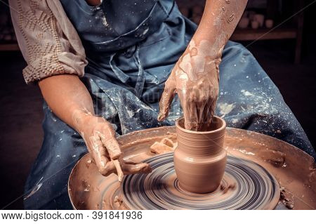 Craftsman Master Making Ceramic Pot On The Pottery Wheel . Concept For Woman In Freelance, Business,