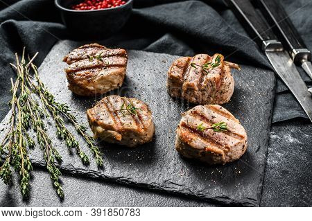 Tender Boneless Grilled Pork Chops. Steak Tenderloin. Black Background. Top View