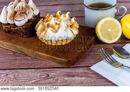 Mini Chocolate And Lemon Pie Cake With Cup Of Tea.