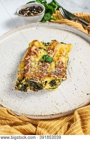 Baked Stuffed Vegetarian Pasta Cannelloni With Broccoli, Spinach, Basil And Cheese. Gray Background.