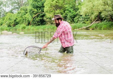 In The Zone Fishing. Hobby And Sport Activity. Pothunter. Fisherman With Fishing Rod. Bearded Fisher