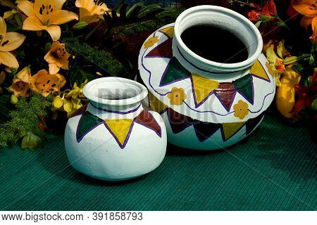 Painted Pots Placed On Green Mat With Flowers And Foliage Behind At Republic Day Horticultural Show 
