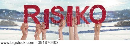 People Hands Holding Word Risiko Means Risk, Snowy Winter Background