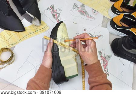 Shoemaker Making Shoe On The Table In Workshop
