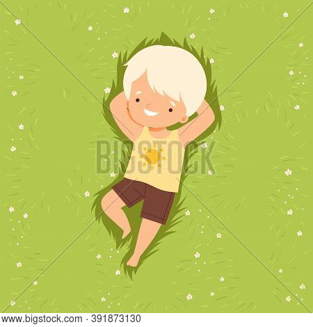 Adorable Smiling Boy Lying Down On Green Lawn, Cute Kid Lying On Grass Dreamily Looking Into Sky Car