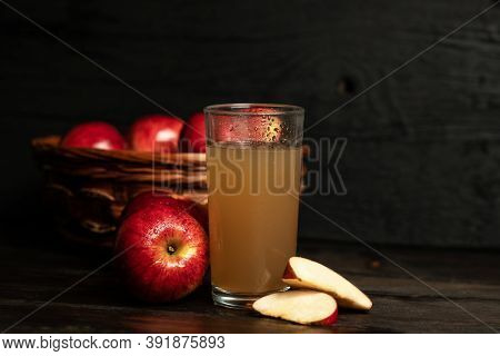 Fresh Apple Juice Surrounded With Red Apples. Freshly Made Apple Juice. Fresh Red Apples.