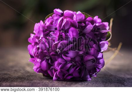 Beautiful Spring Bouquet Of Violets (viola Odorata) On Wooden Background. Wild Common Violet Flowers