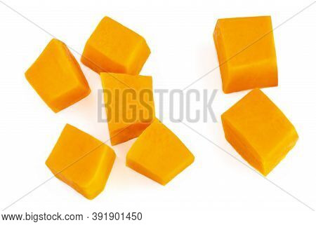 Diced Pumpkin  Isolated On White Background.  Fresh Pumpkin Pieces Cut In A Cube Slice, Top View. Fl