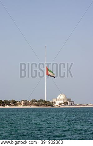 The Large United Arab Emirates Flag In Abu Dhabi Flying At Half-mast During The 40 Days Mouring Peri