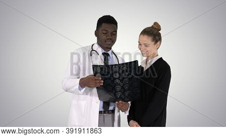 Young Woman Visiting Radiologist For X-ray Exam Of Her Brain On