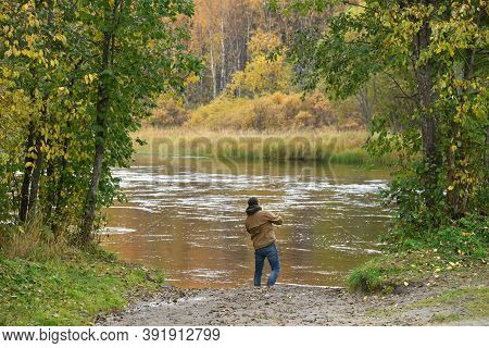 Man Is Fishing On A River On An Autumn Day. Active Lifestyle, Outdoor Recreation. Karelia, Russia