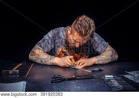 Leather Worker Wording With Leather Goods At Workplace