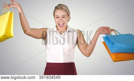 Image Of A Lovely Shopping Lady Holding Her Purchases On Gradien