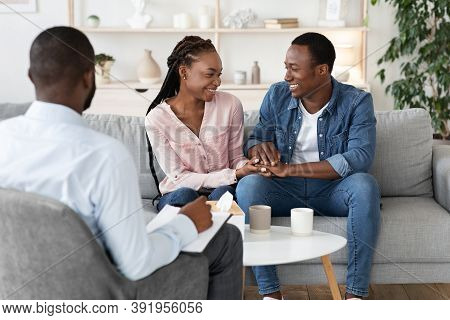 Reconciliation Concept. Happy Young Black Couple Holding Hands On Reconciling Session At Marital The