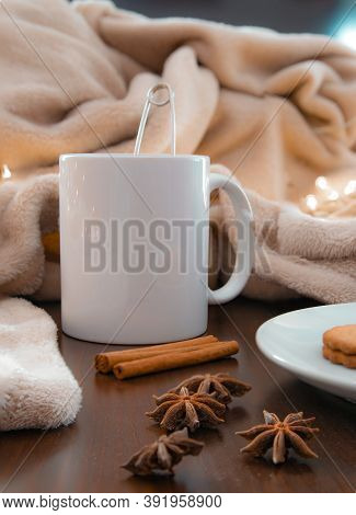 Living Room Details In Winter. Close-up Of A White Cup With An Infusion On A Wooden Table With Anise