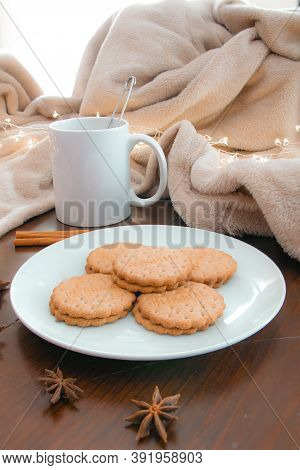 Living Room Details In Winter. Close-up Of A White Mug With An Infusion On A Wooden Table With Anise