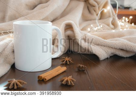 Living Room Details In Winter. Close-up Of A White Cup With An Infusion On A Wooden Table With Anise