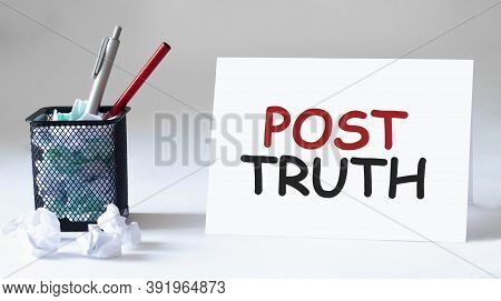 Blank Sheet, Pen And Crumpled Paper Balls On Grey Table, Flat Lay. Text Post Truth