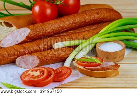 Chives, Tomatoes And Kielbasa On Wooden Background. Close Up.