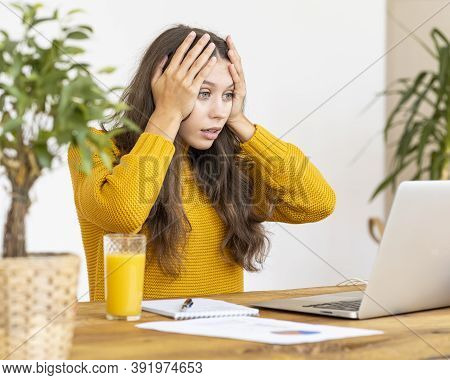 Girl Surprising, Upset, Horror On Face. Beautiful Young Woman Working On Laptop