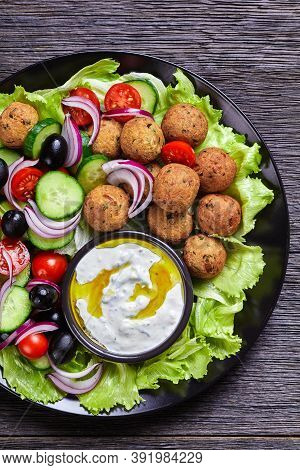 Mediterranean Platter Of Falafels, Tomatoes, Cucumber, Red Onion, Black Olives, On The Fresh Salad L