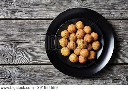 Mediterranean Deep-fried Falafels, Of Chickpeas With Spices With Coriander And Cumin On A Black Plat