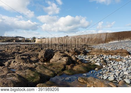 Coast And Breakwater Of Le Loch Harbor In Primelin At Low Tide