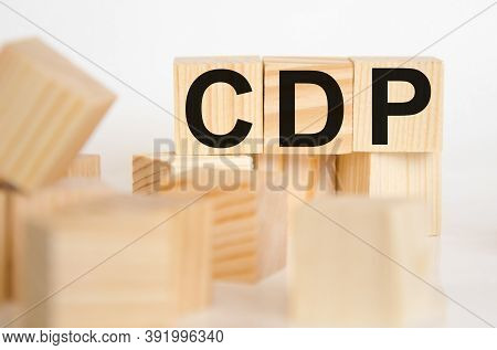 The Word Is Written On Wooden Cubes, In The Foreground Cubes In A Blurred Background. The Word Cdp I
