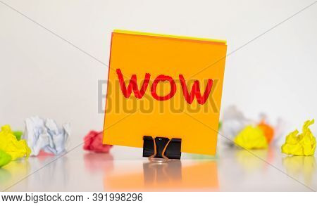 Creative Word Wow On Multicolored Stickers Against The Background Of A Cork Board