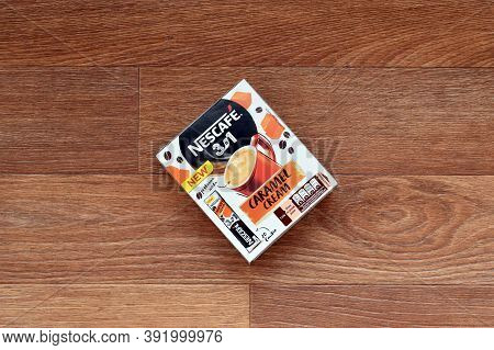 Nescafe Caramel Cream Coffee Sticks Box On Wooden Background. Nescafe Is A Brand Of Coffee Made By N