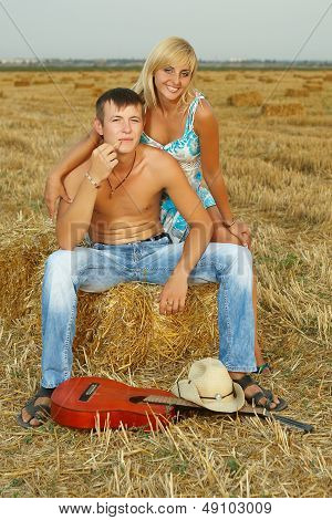 A Pair Of Lovers In The Hay With Guitar