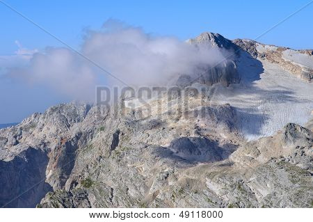 Rocky Mountains In Caucasus Scenery Of Fisht Peaks With Blue Sky And Clouds