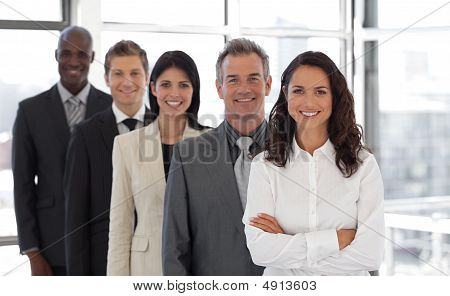 Hispanic Business Woman Leading A Team Of Workers