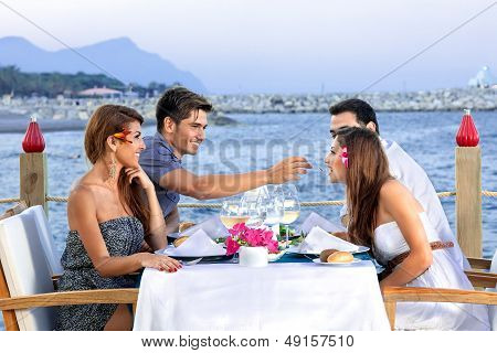 Two Couples Celebrating At The Sea