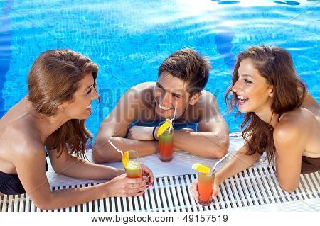 Guy Flirting With Two Women At The Swimming Pool