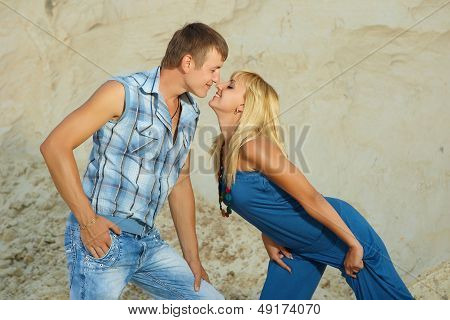 Guy And  Girl In  White Sand