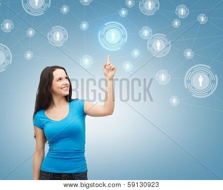 communication and future technology concept - attractive teenager in casual clothes pointing her at social network