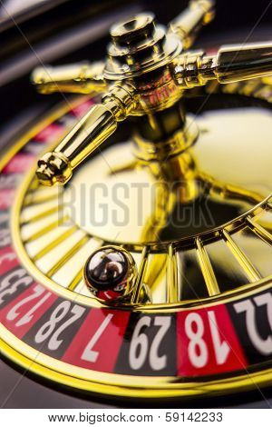 the cylinder of a roulette gambling in a casino. winning or losing is decided by chance.