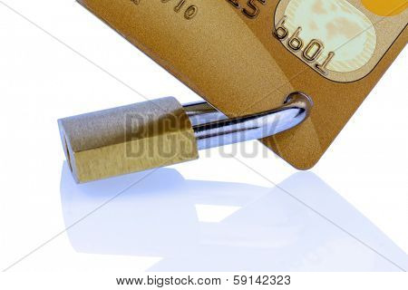 a golden credit card and padlock. symbolic photo for cashless purchases and status symbols.