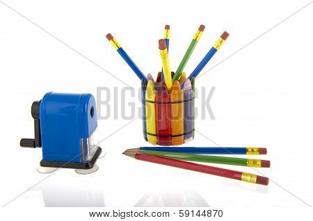 Collage Of Pencils In A Cup With A Blue Pencil Sharpener