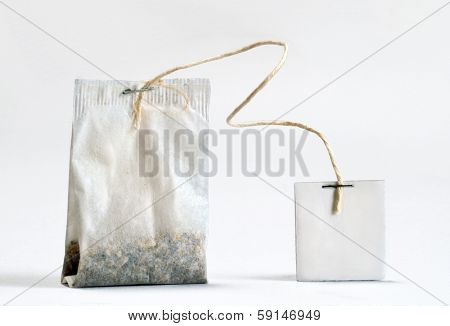 Teabag with white label. Isolated on white background.