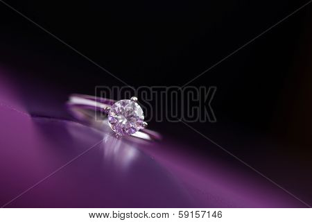 White Gold Ring With Diamonds On Colored Background