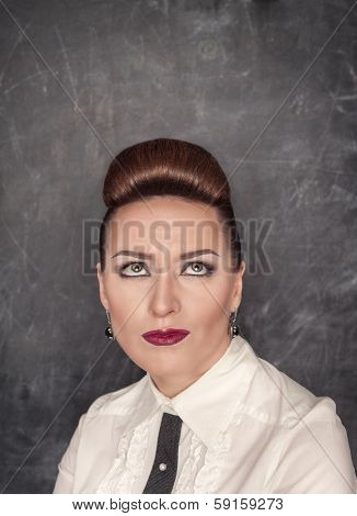 Woman With A Skeptical Expression Looking Up Above