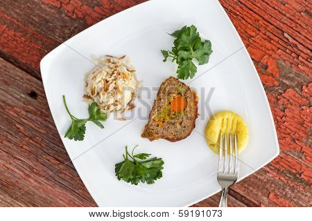 Vegetable Stuffed Meatloaf Served With Rice Pilaf