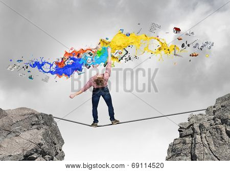 Young man in casual evading from flying icons