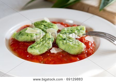 Gnocchi With Wild Garlic In Tomato Sauce And Parmesan Cheese