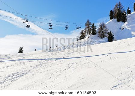 Ski Lift And Slope Of Dolomites Mountains
