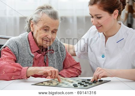 Senior Woman Playing Checkers